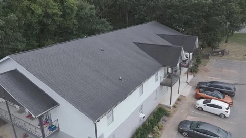 Close drone orbit around suburban apartment building and parking Stock Footage 346732268