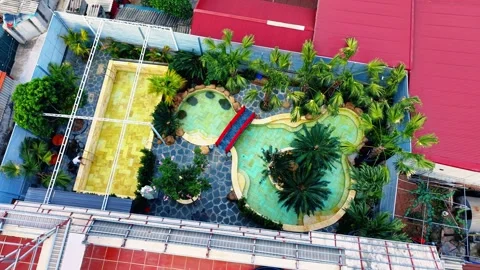 Close up drone orbit focusing on private indoor thermal hot spring pool 4K Stock Footage 340748030