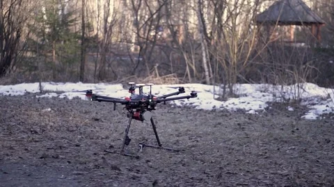 Close Up Drone Ready for Takeoff on Ground Before Aerial Video Shooting Stock Footage 333367527