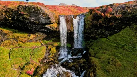 Close up drone shoot of waterfall running down the cliff, view of scenic autumn Stock Footage 233035518