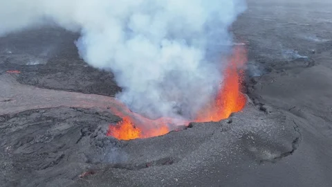 Close-Up Drone Shot of Active Lava Fountain and Erupting Volcano Cone in Iceland Stock Footage 321133138