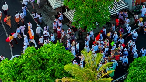 Close-Up Drone Shot Large Crowd Walking After Melasti Ceremony Bali 4K Stock Footage 334321707