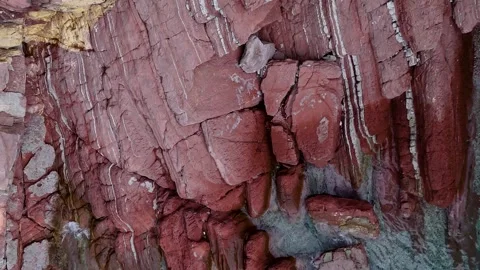 Close Up Drone Shot of a Red Sedimentary Rock Cliff Face Texture Stock Footage 317206753