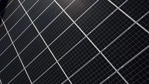 Close up drone shot of solar panels located on roof on a building. Producing ele Stock Footage 220282267