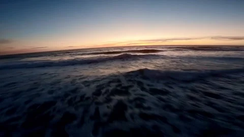 Close drone shot of waves at sunset 動画素材 224161617