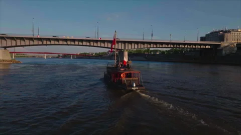 Close-up drone tracking boat about to cross bridge, Warsaw Video stock 339173238