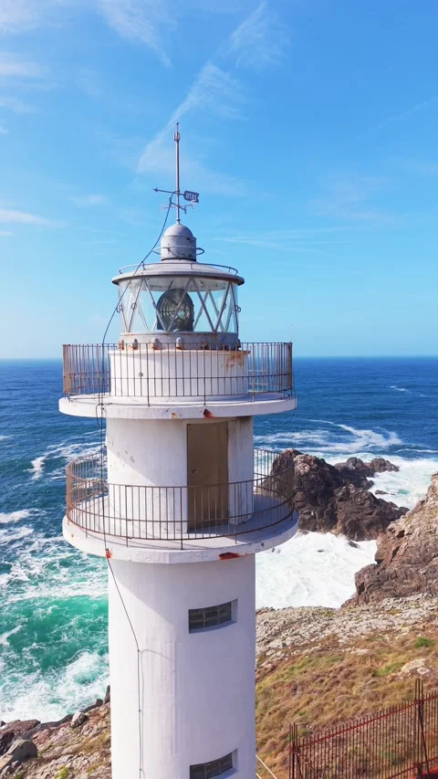 Close drone view of Faro de Cabo Tourinan lighthouse lantern room Stock Footage 345340927