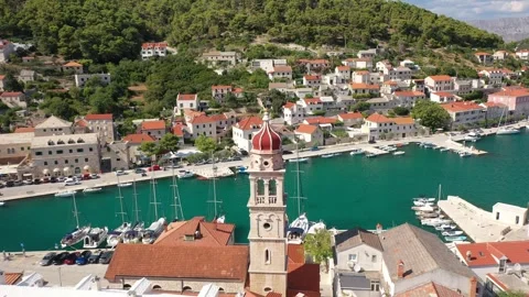 Close-Up Drone View of Pucisca Church with Panoramic Look at the Village Video stock 301111165