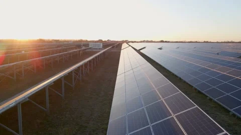 Close up drone view of solar panels stand in a row in the fields power ecology Stock Footage 165477092