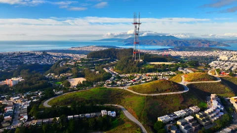 Close drone view of Sutro Tower on Twin Peaks hill with Golden Gate Bridge in Stock Footage 337462075