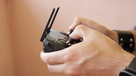 Close up of drone's pilot while filming, rc helicopter's remote controller. Stock Footage 137018895