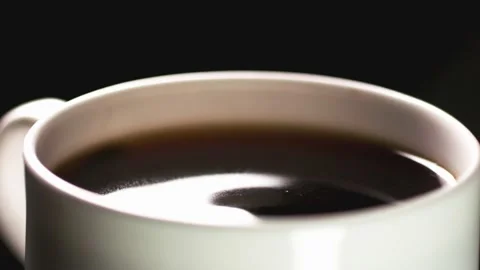 A close-up of a drop of coffee dripping Stock Footage 234192722