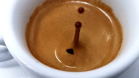 Close Up Of A Drop Falling In A Cup Of Coffee. Slow Motion Stock Footage 168255377