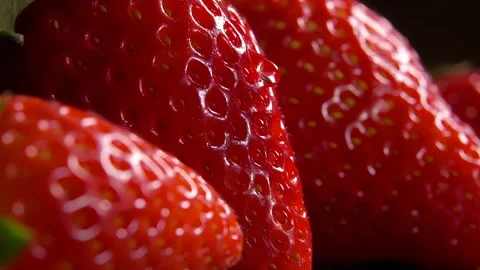 Close-up of a drop flowing down a strawberry Stock Footage 274471934