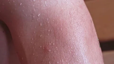 Close-up of a drop of water on the body after a shower. Drops of sweat on a man Stock Footage 223880002