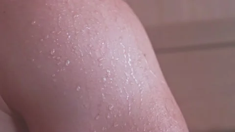 Close-up of a drop of water on the body after a shower. Drops of sweat on a man Stock Footage 232269637