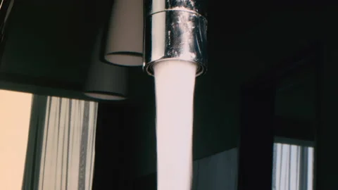 Close up Drop of water drips from the tap. Water tap in kitchen. Water supply. Stock Footage 202214057
