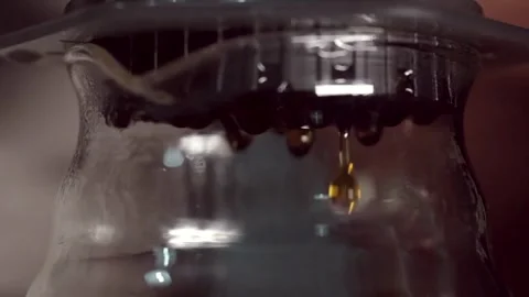 Close up droplet from automatic coffee maker caffeine working filtration in Video stock 336585320