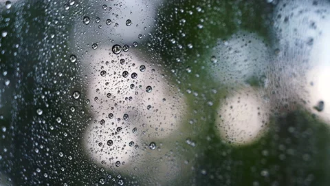 Close up droplets of the rain on window glass on a rainy day. Stock-Footage 153908083