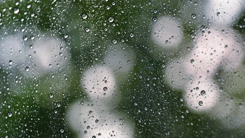 Close up droplets of the rain on window glass on a rainy day. Stock-Footage 153908264