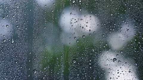 Close up droplets of the rain on window glass on a rainy day. Stock-Footage 153908945