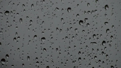 Close Up of Droplets on a Window During a Rainy Gray Day Video stock 36723532