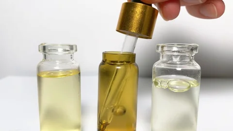 Close up of dropper with CBD. CBD pipette.  Bottle of Cannabis oil. Oil bottles Stock Footage 122699770