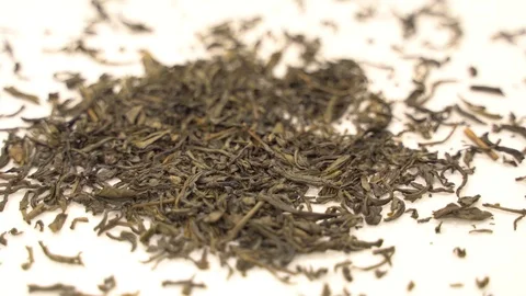 Close up dropping tea leaves slow motion Video stock 110897451