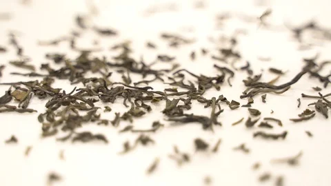 Close up dropping tea leaves slow motion Stock Footage 110897586