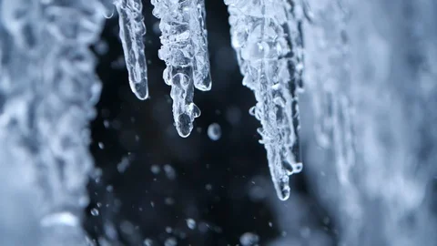 Close up drops from icicles, Carpathian mountains, Ukraine Stock Footage 128203845