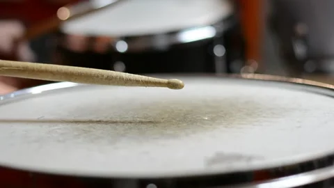 Close up of a drum being hit with drumstick multiple times. Stock Footage 323931298