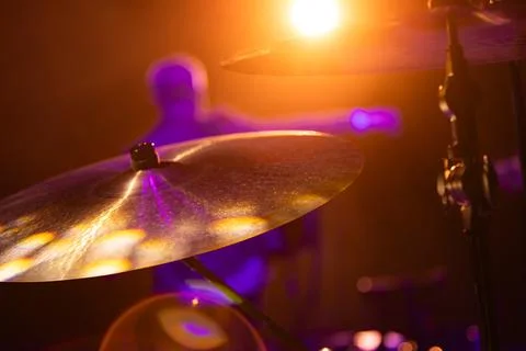 Close-up of drum kit cymbals on stage during a live music concert with a bl.. Stock Photos