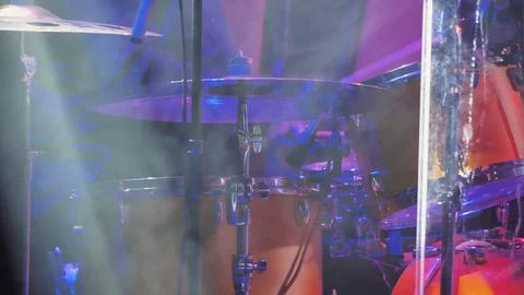 Close-up of a drum kit with various elements: cymbals, drum and drumsticks. T Stock Photos