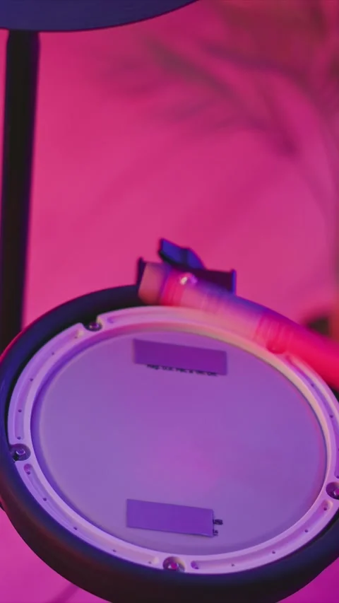 Close up of Drum Pad with Pink and Purple Vibrant Lighting Detail with light Stock Footage 345988883