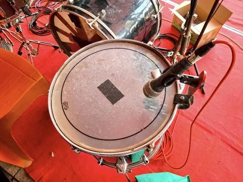 Close up of drum snare with microphone on red stage floor Stock Photos