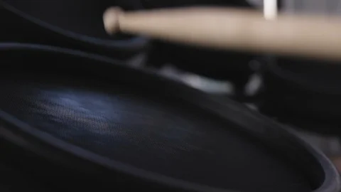 Close up of drum sticks hitting an electric drum in slow motion Stock Footage 111551129