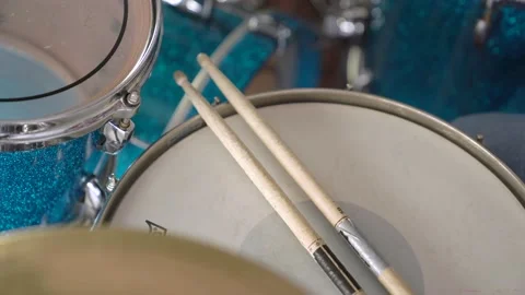 Close up of Drum sticks lying on a blue drum. Stock Footage 155554533