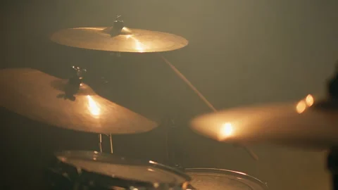 Close-up drummer hands hit the drum cymbal with drumstick in a dark studio Stock Footage 265614296