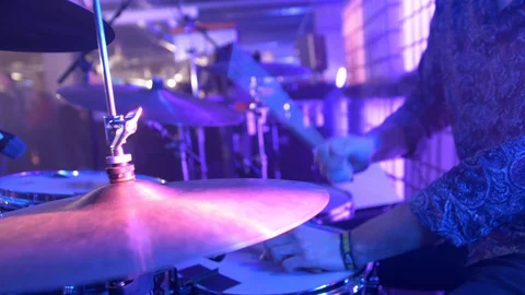 CLOSE UP OF DRUMMER HITTING DRUMS WITH ONE STICK Stock Footage 128373915