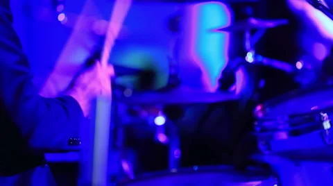 Close-up of drummer performing for a rock band Stock Footage