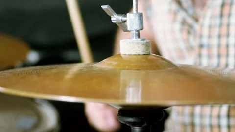 Close-up of drummer playing the drums by hitting it with sticks. Slow motion. HD 動画素材 109287519