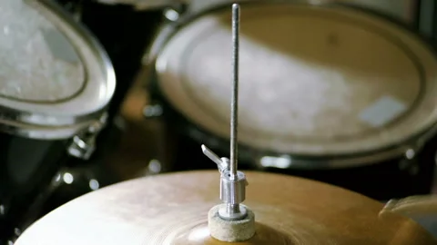 Close-up of drummer playing the drums by hitting it with sticks. Slow motion. HD Stock Footage 109287522