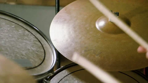 Close-up of drummer playing the drums by hitting it with sticks. Slow motion. HD 動画素材 110226484