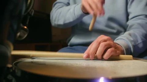 Close-up of drummer playing energetic rhythm on snare drum and hi-hat with Video stock 312845497