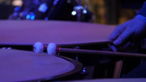 Close-up of a drummer playing timpani at the orchestra concert Stock Footage 153089799