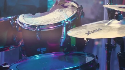 Close-up of a drummer's hand playing a drum cymbal at a rock concert Stock Footage 259933603