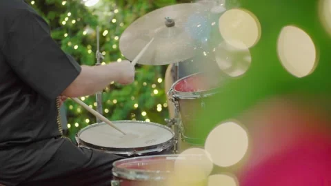 Close-up of drummer's hands beating on drums with sticks, in Christmas eve festi Stock Footage 258876045