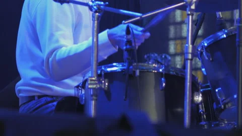 Close-up of drummer's hands playing drum kit during live concert Stock Footage 340516330