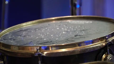 Close up of drums with styrofoam balls for special effect hit by unrecognizable Stock Footage 81227696