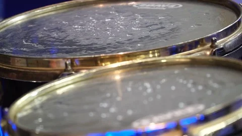 Close up of drums with styrofoam balls for special effect hit by unrecognizable Stock Footage 81227763
